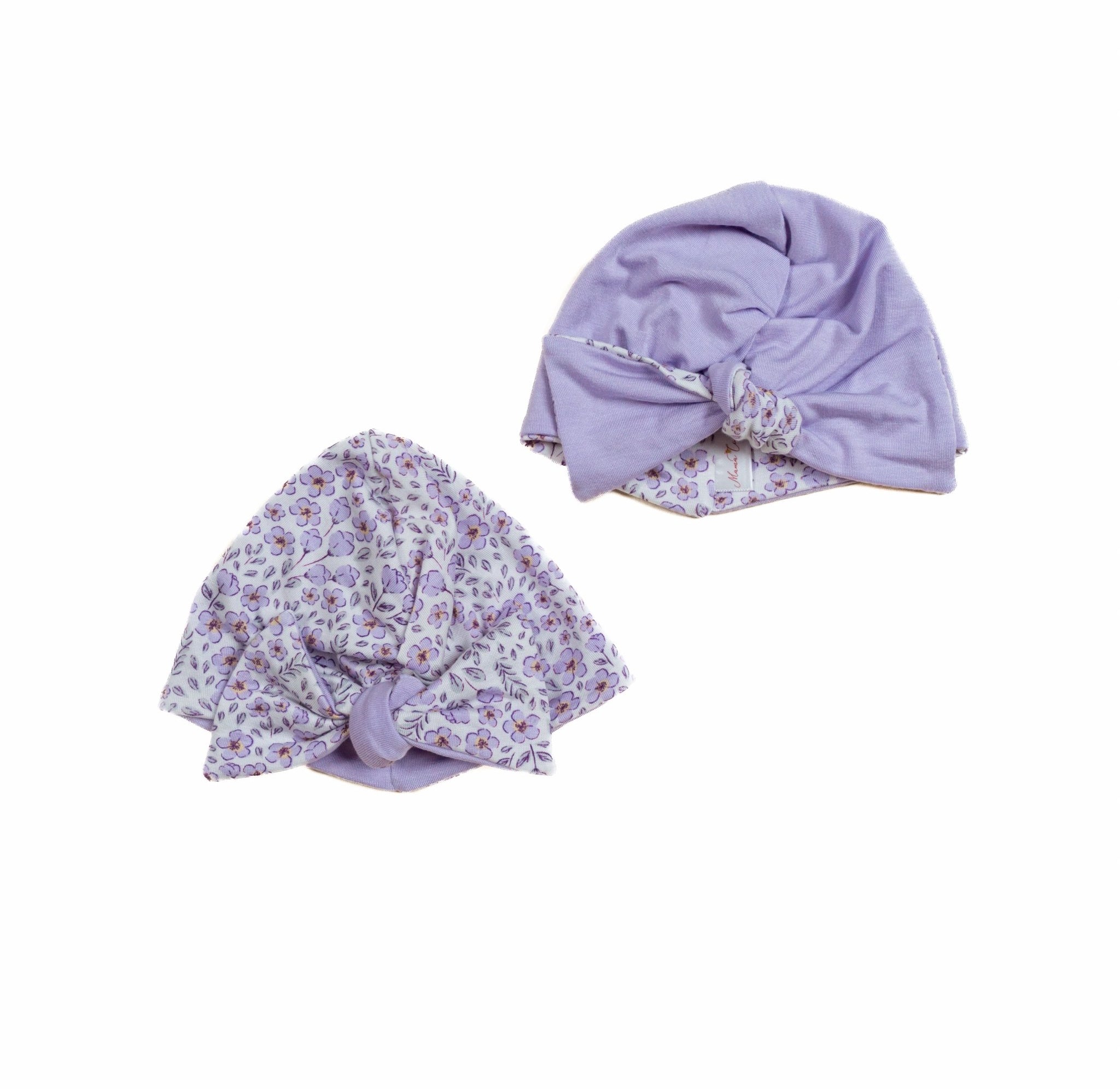 Reversible baby ruched bow beanie in purple posies design.