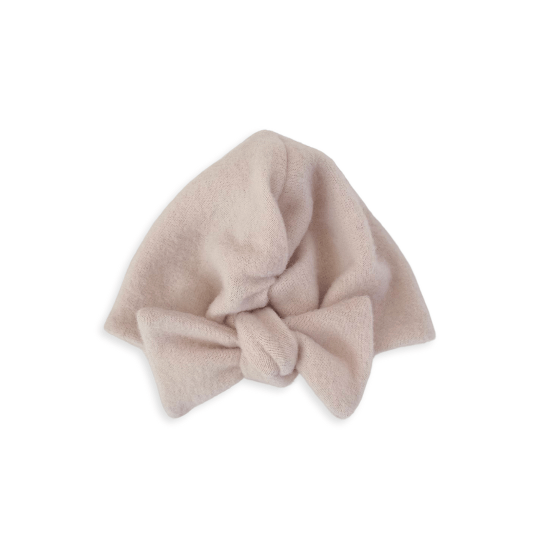 Ruched beanie with bow in Plush Latte design, made from Plush Dream fabric.