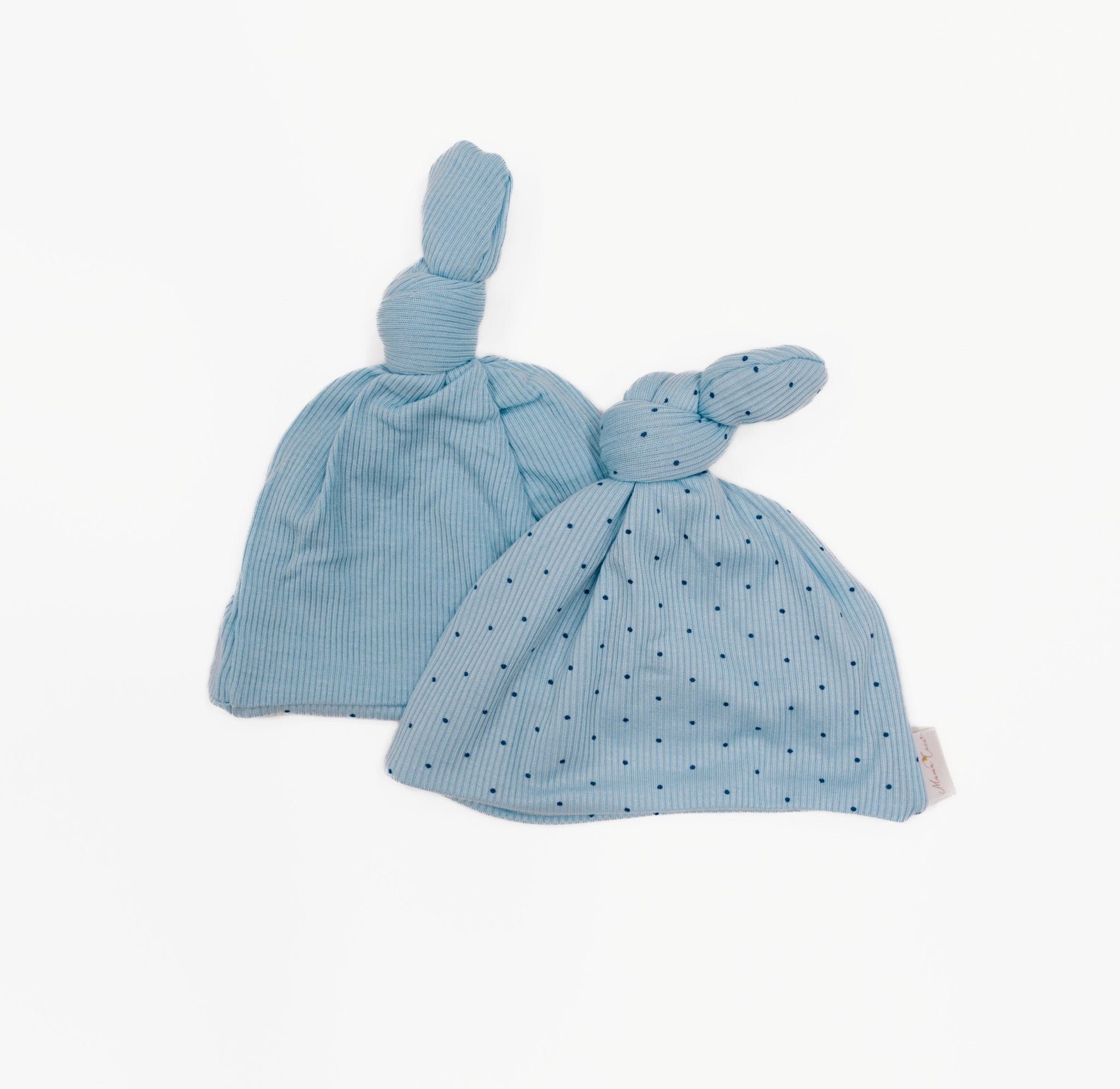 Reversible baby knotty beanie in dotted blues design.