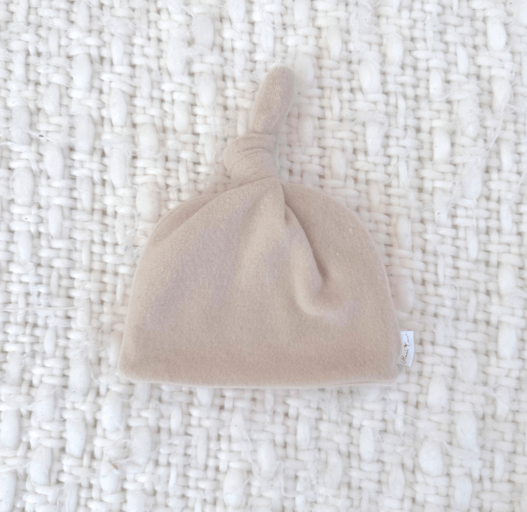 Knotty beanie in Plush Latte design, made from Plush Dream fabric.