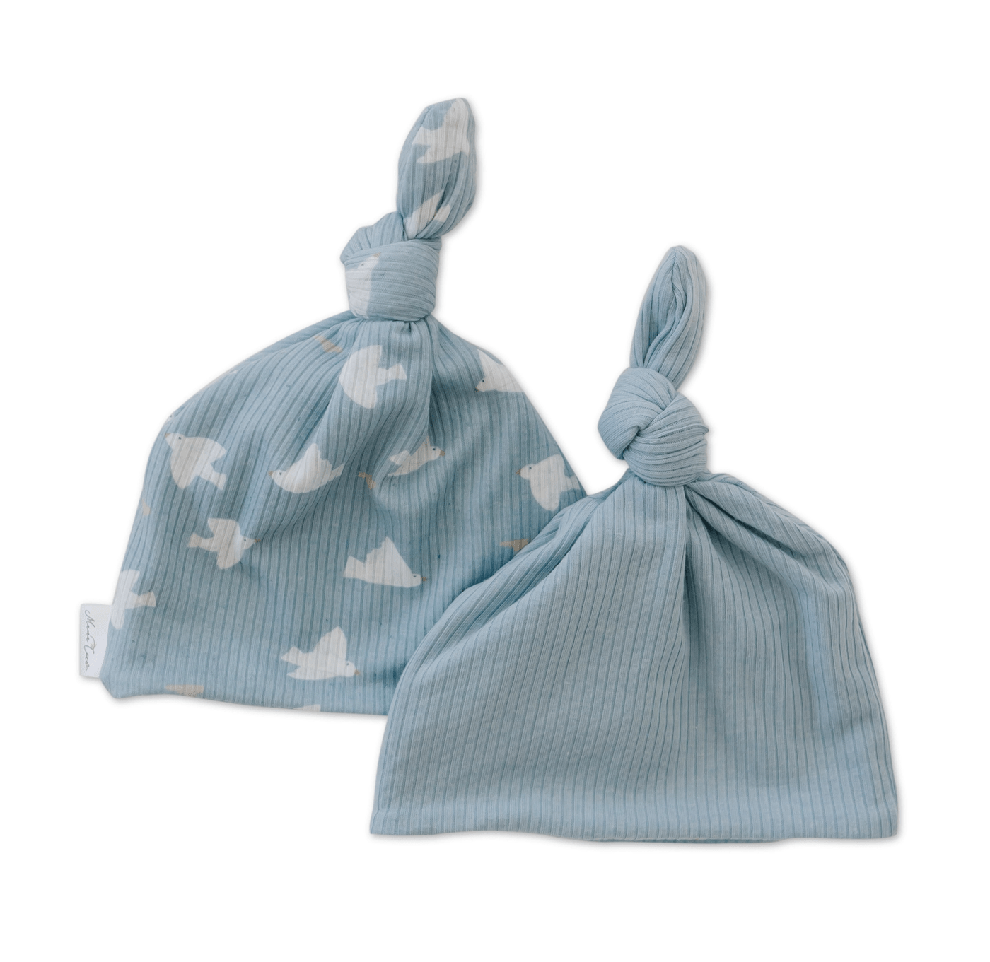 Reversible baby knotty beanie in brushed viscose fabric.