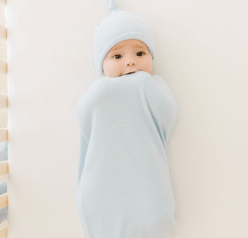 Reversible Baby Cocoon swaddle baby blanket in plush powder blue design in plush dream fabric styles.
