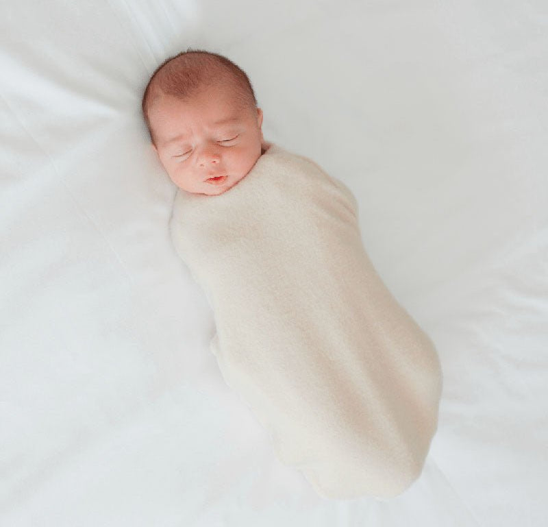 Reversible Baby Cocoon swaddle baby blanket in plush latte design in plush dream fabric styles.