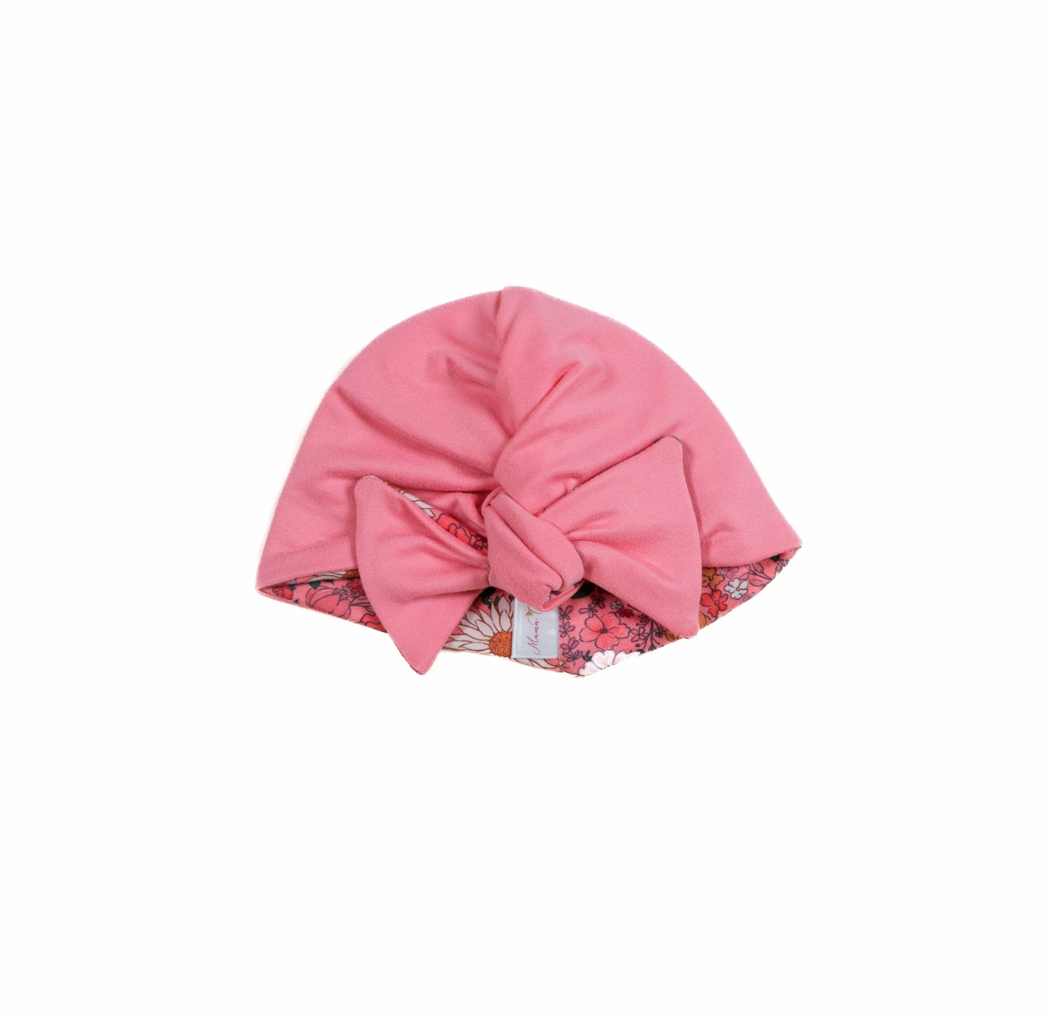 Reversible classic brushed fabric makes this Flower Power ruched baby beanie with bow soft for everyday wear.