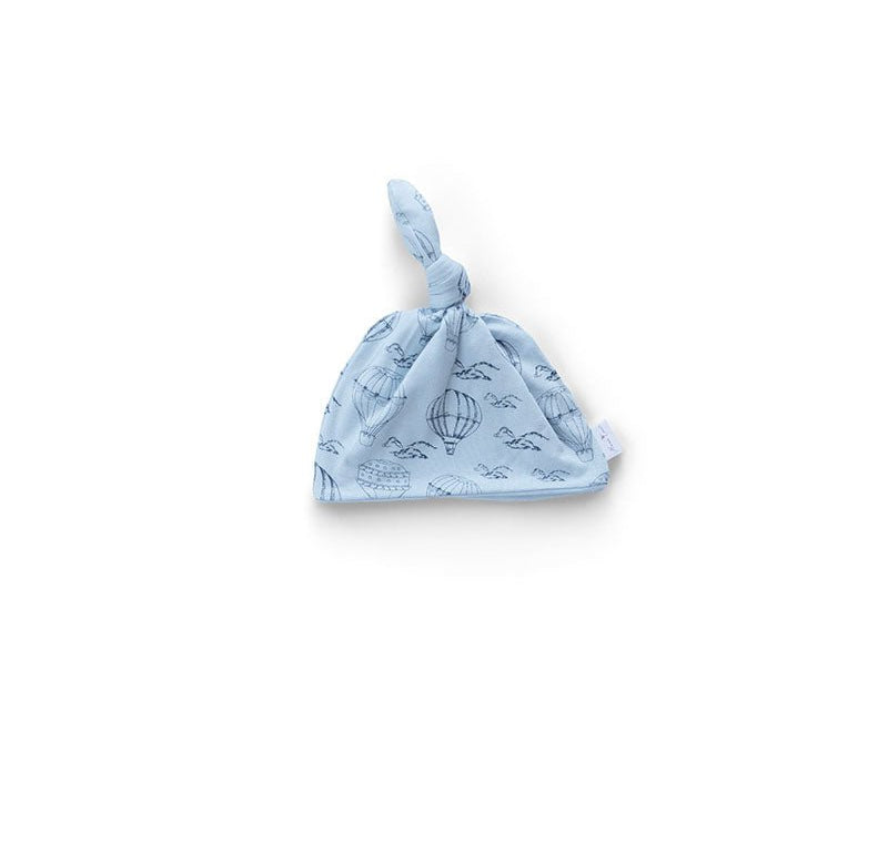 Reversible baby knotty beanie in bon voyage design.