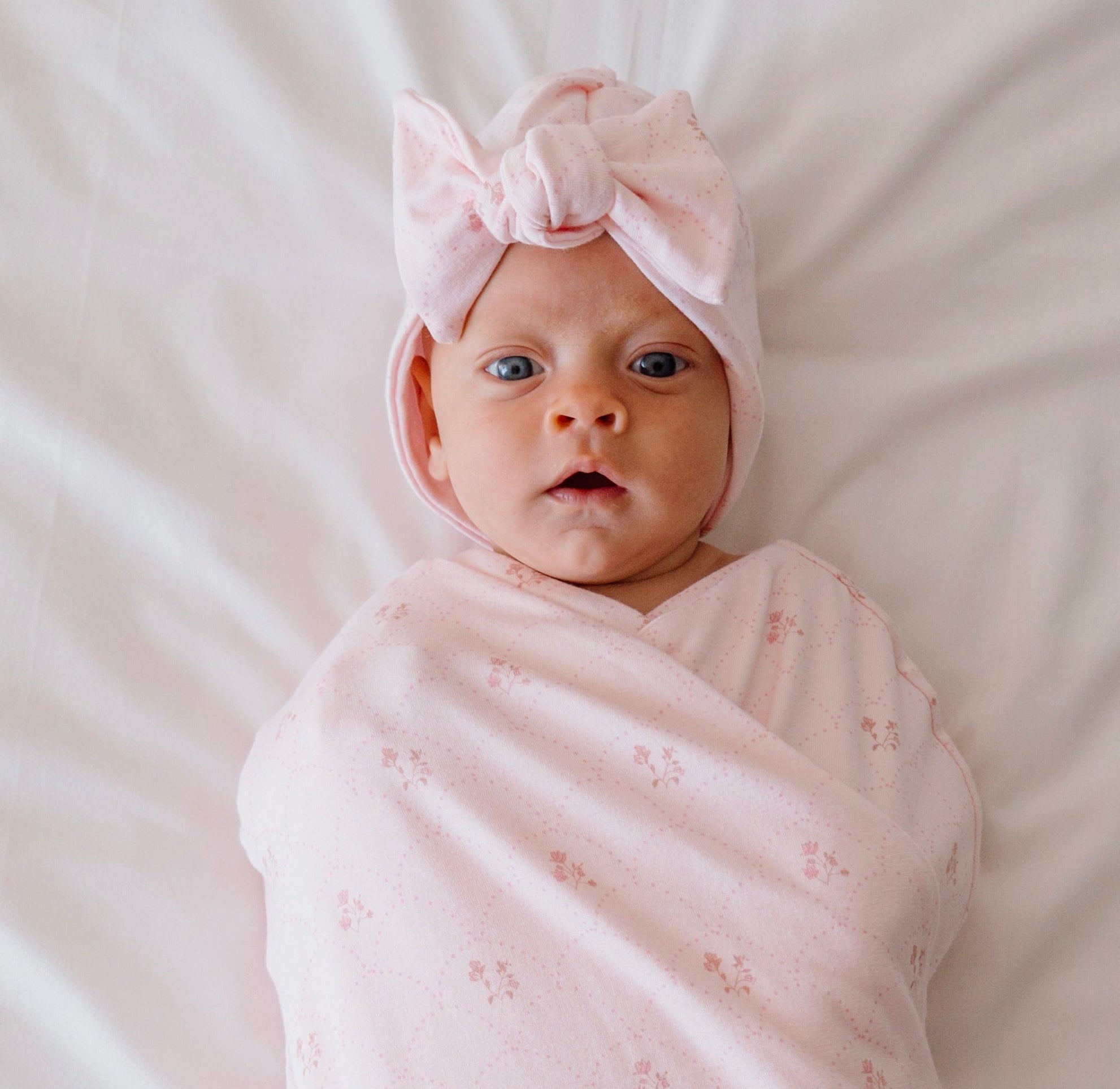 Bamboo cotton baby beanie with ruched bow in dainty dots design.