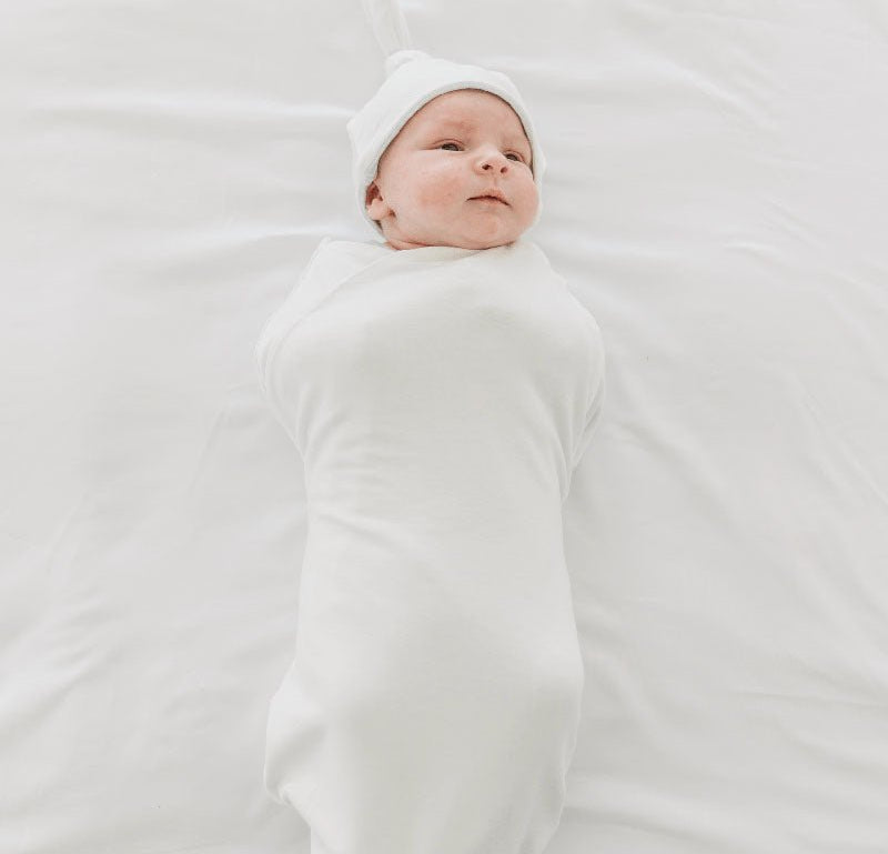 Timeless Baby Blue Gingham print on a Cocoon swaddle newborn blanket in Silky Modal fabric styles.