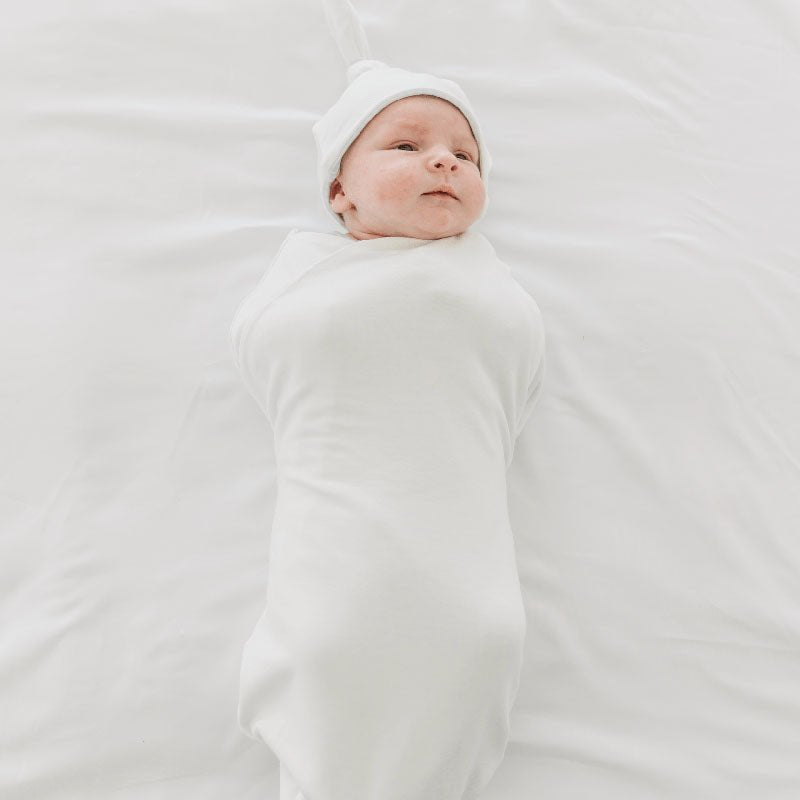 Timeless Baby Blue Gingham print on a Cocoon swaddle newborn blanket in Silky Modal fabric styles.