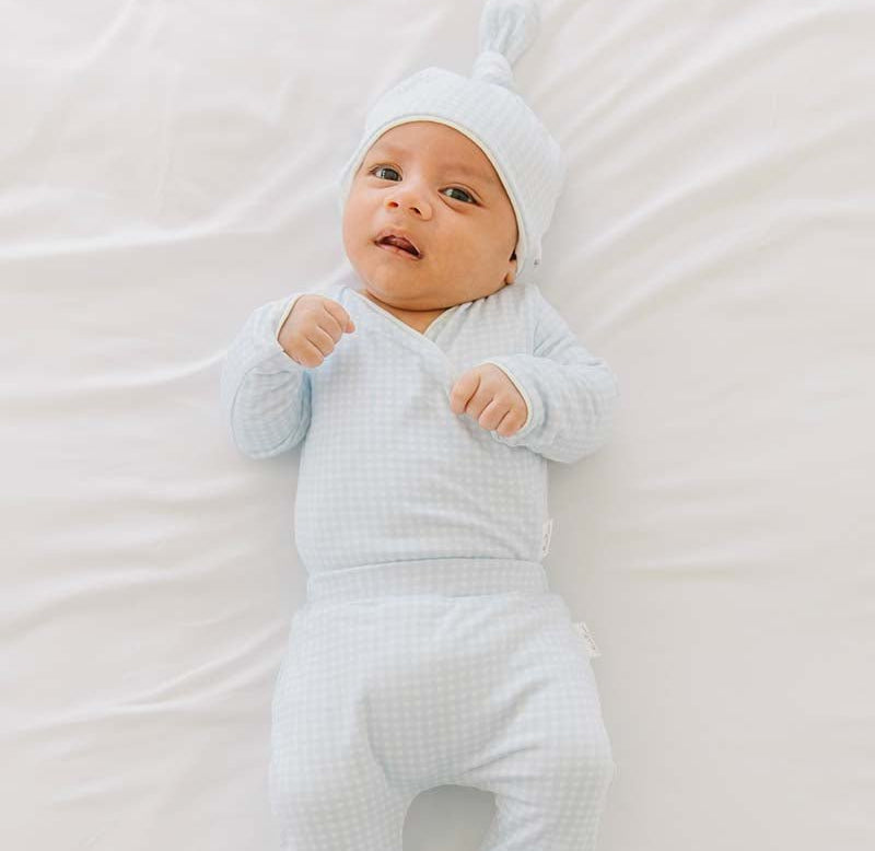 Baby blue gingham long-sleeve winged bodysuit.