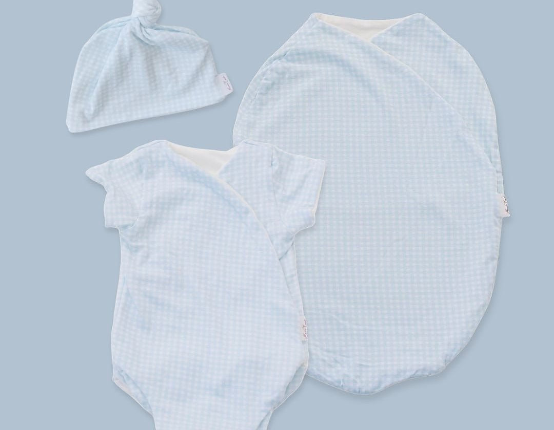 Short sleeve newborn essentials bundle in silky modal fabric with baby blue gingham design.