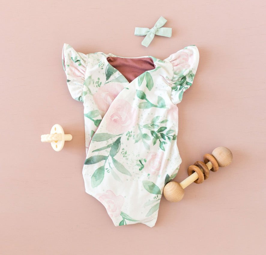 Blushing Eucalyptus baby bodysuit with short sleeves in soft Classic Brushed fabric styles.