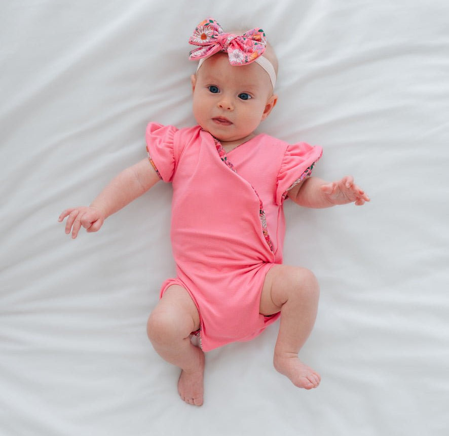 Reversible Flower Power print baby bodysuit crafted in Classic Brushed fabric styles.