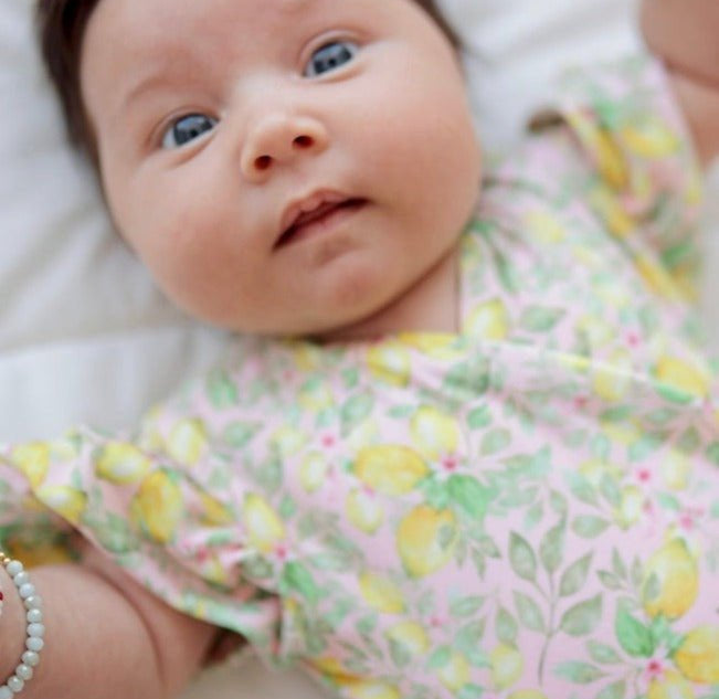 Pink Lemonade print short-sleeve bodysuit for baby in premium Classic Brushed fabric styles.