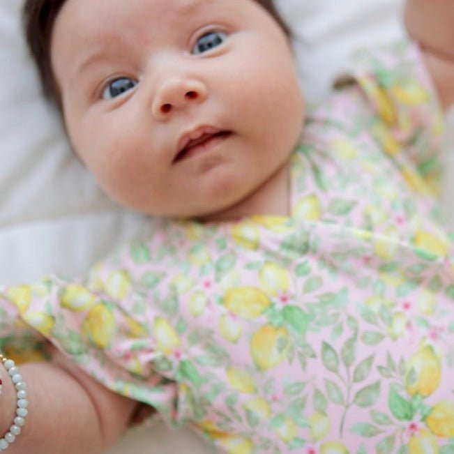 Pink Lemonade print short-sleeve bodysuit for baby in premium Classic Brushed fabric styles.