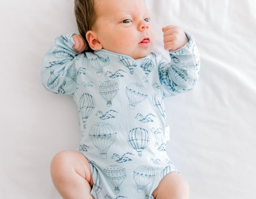 Bon voyage newborn baby clothing bundle in classic brushed fabric with long sleeve ruffle cuff detail.