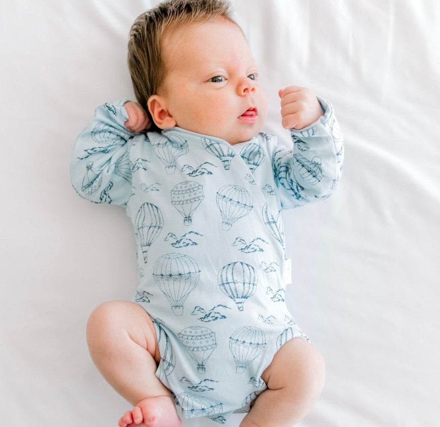 Bon voyage newborn baby clothing bundle in classic brushed fabric with long sleeve ruffle cuff detail.