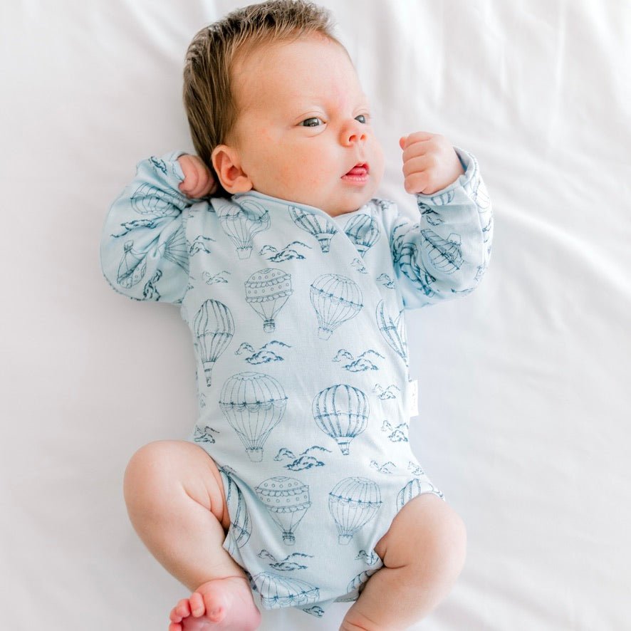 Bon voyage newborn baby clothing bundle in classic brushed fabric with long sleeve ruffle cuff detail.