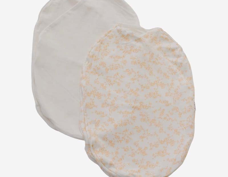 Baby cocoon swaddle featuring our bitty blooms design, made from silky modal fabric.