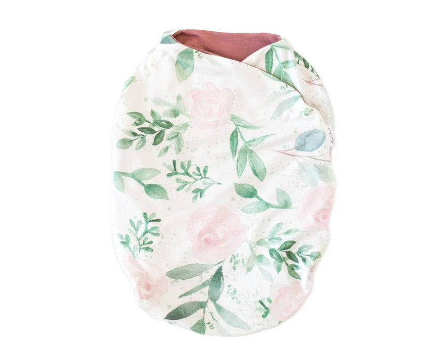 Blushing eucalyptus design baby cocoon swaddle in classic brushed fabric.