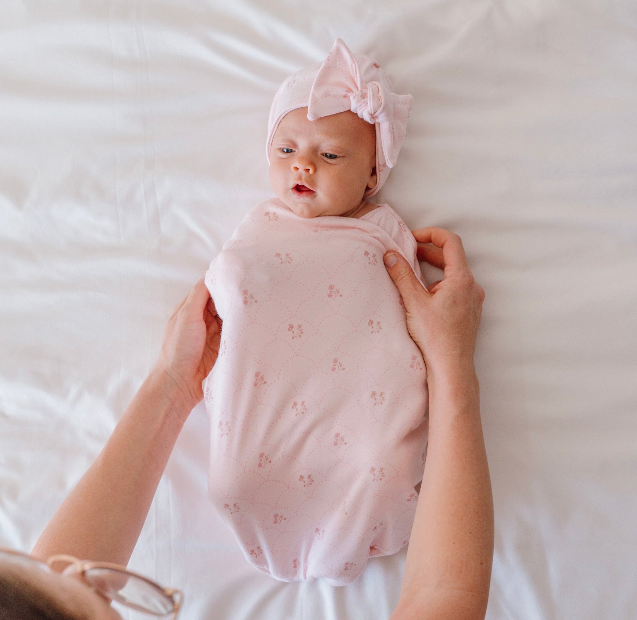Reversible dainty dots design cocoon baby swaddle in bamboo cotton fabric.