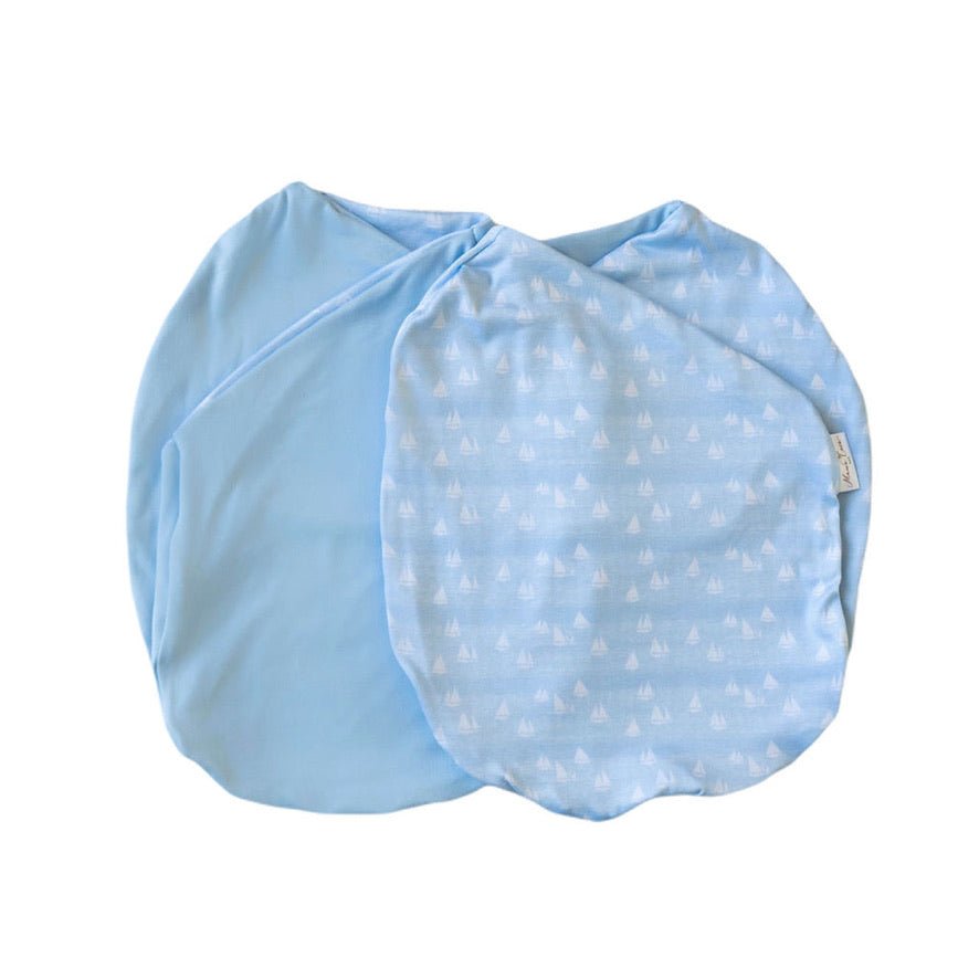 Baby cocoon swaddle featuring our sailboat shores design, made from classic brushed fabric.