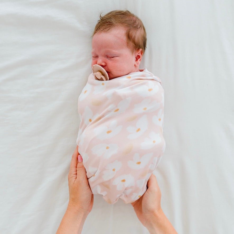 Baby cocoon swaddle featuring our sweet lily design, made from classic brushed fabric.