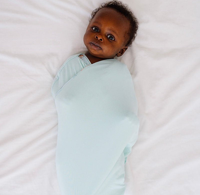 Reversible breathable baby cocoon swaddle blanket in World Traveler design Silky Modal.
