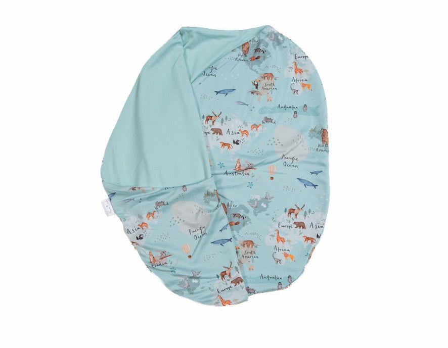Baby cocoon swaddle featuring our world traveler design, made from classic brushed fabric.