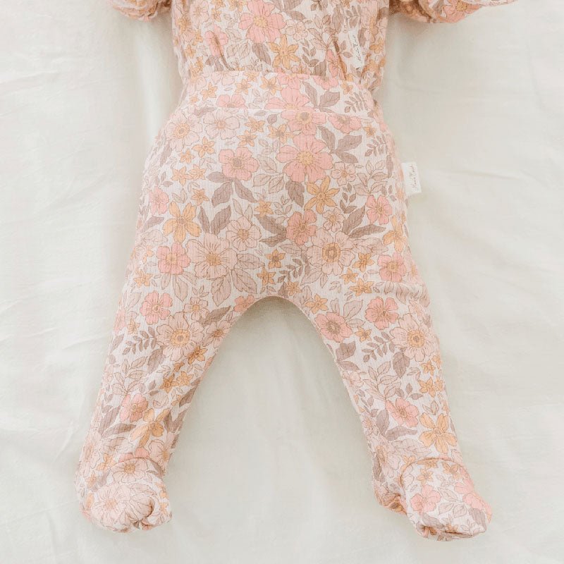 Sugar Plums print baby footie pants created from premium bamboo organic cotton fabric.