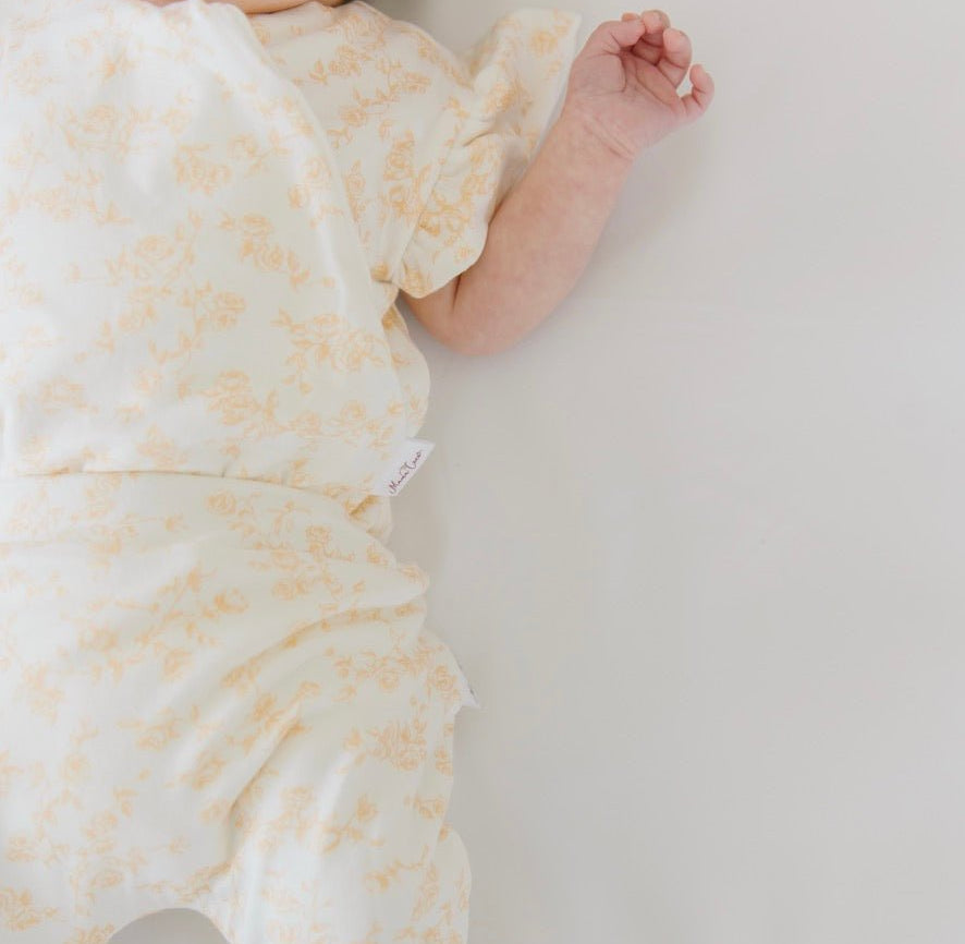 Baby footie pants in bitty blooms design.