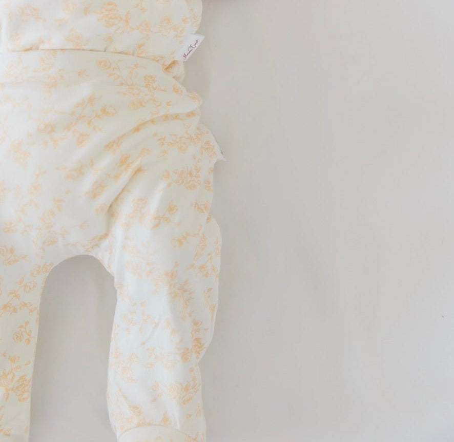 Baby footie pants in bitty blooms design.
