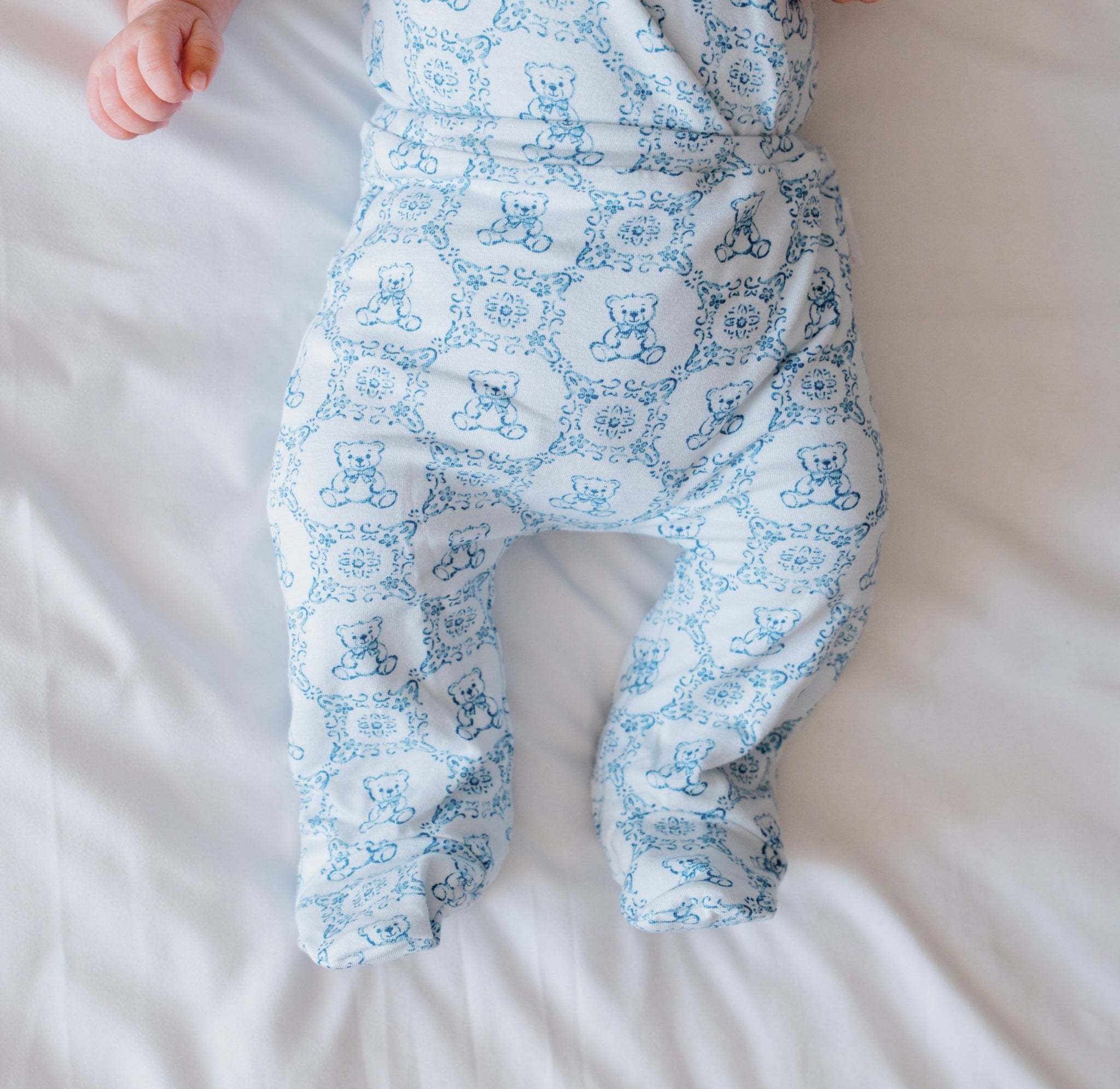 Reversible baby footie pants in teddy tiles design.