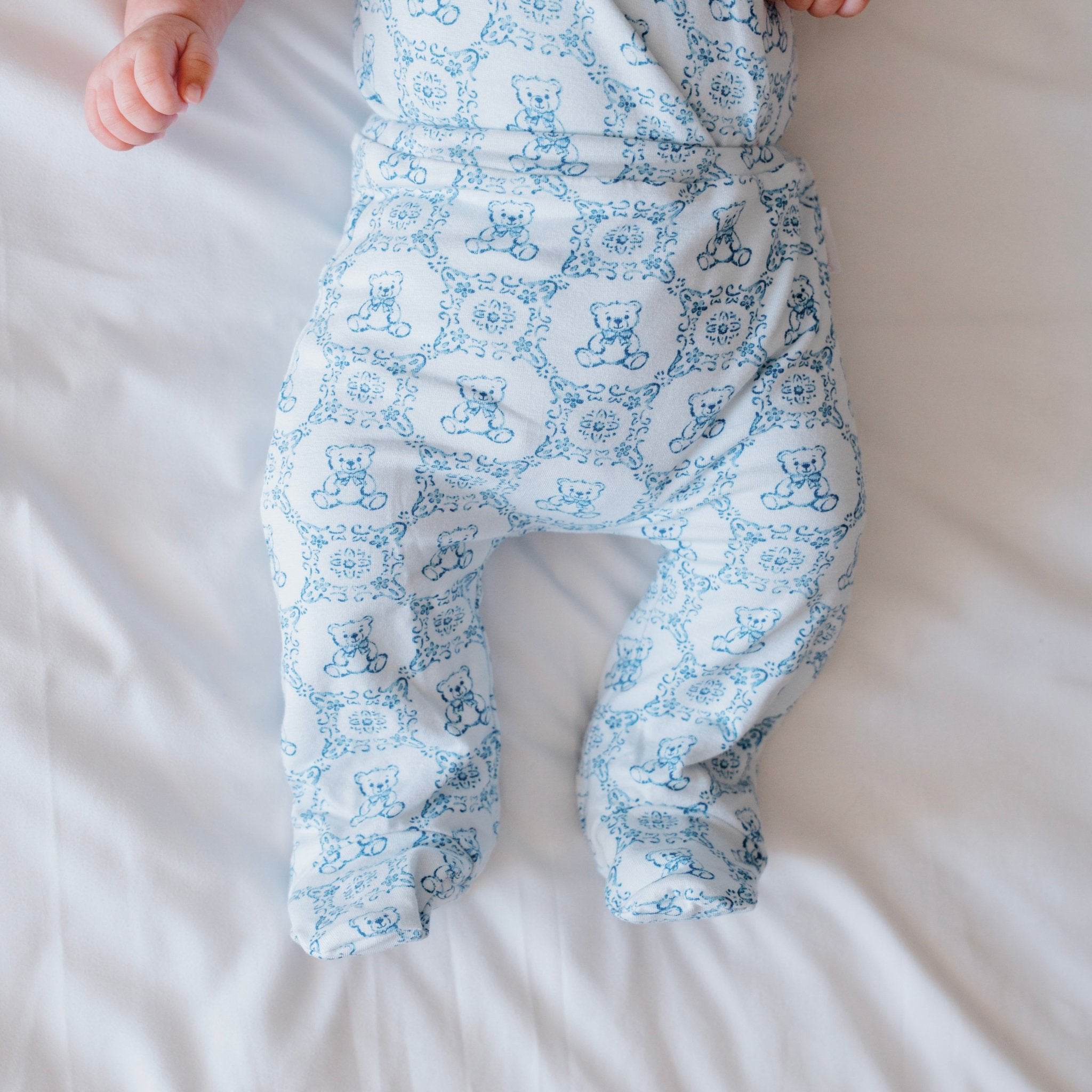 Reversible baby footie pants in teddy tiles design.