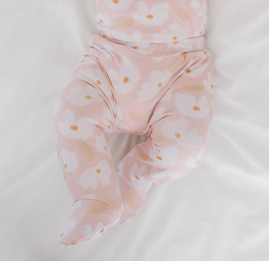 Reversible footie pants in sweet lily design.