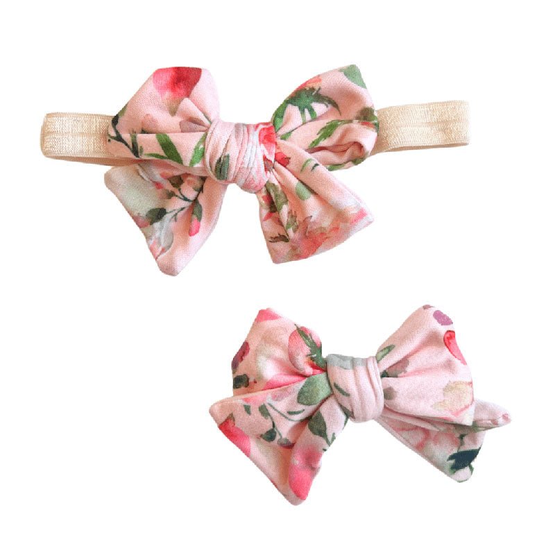 Soft baby bow headband and bow clip featuring the Peachy Rose Fields floral print.