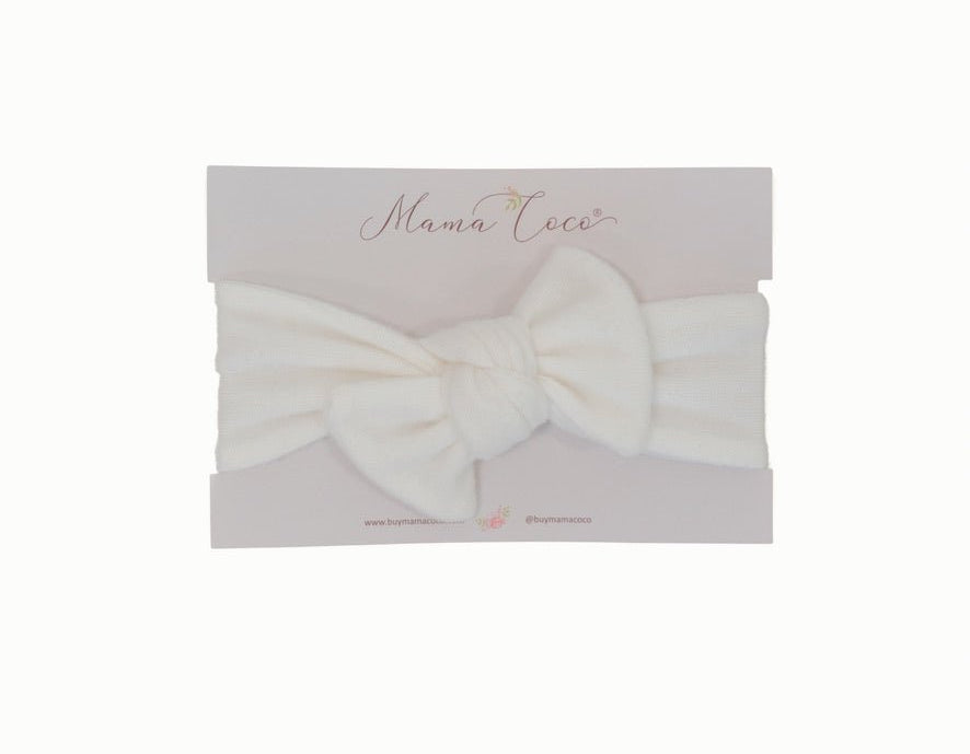Charming baby headwrap with decorative bow in Plush Perfection styles.
