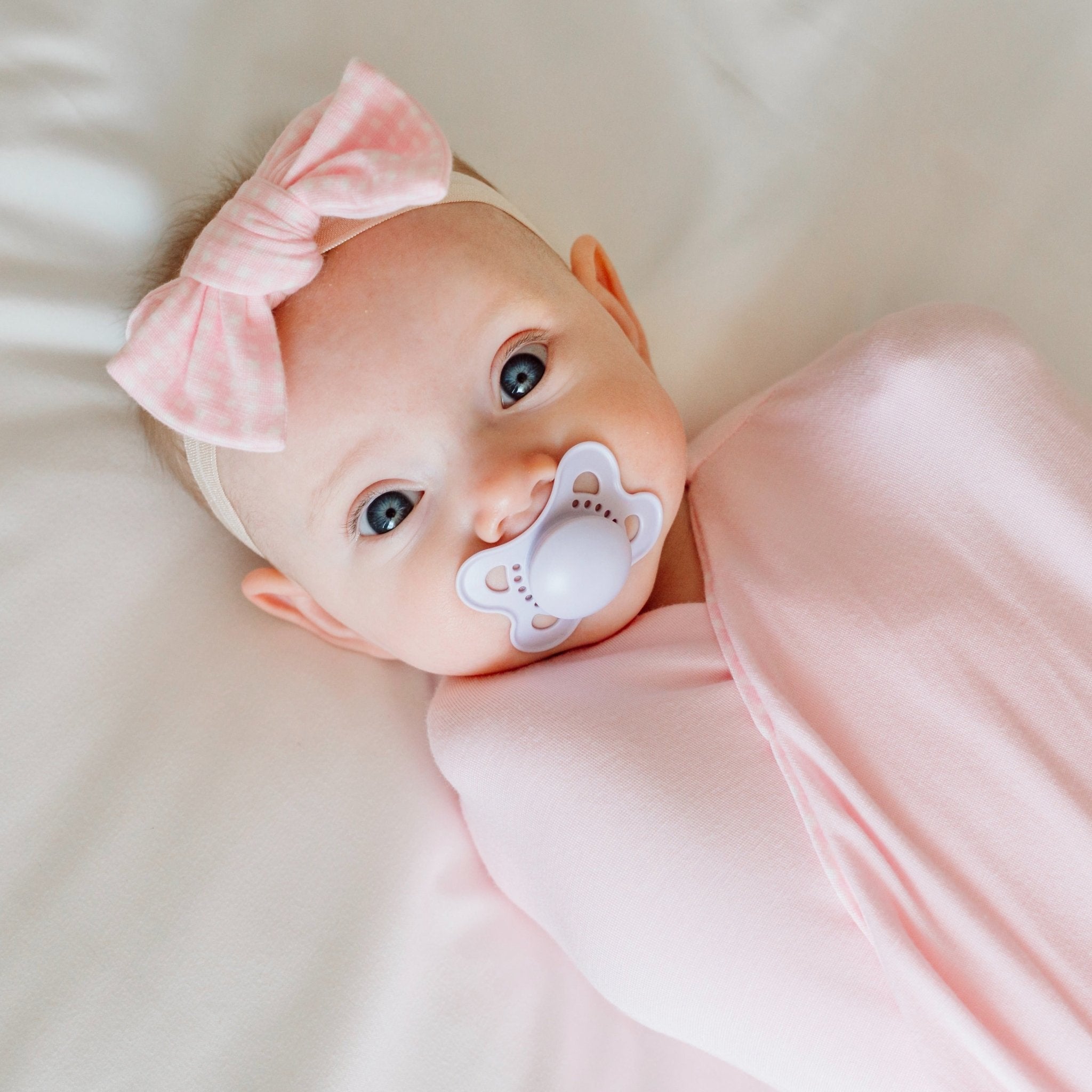 Headband and bow set crafted in soft Baby Pink Gingham design silky modal fabric.