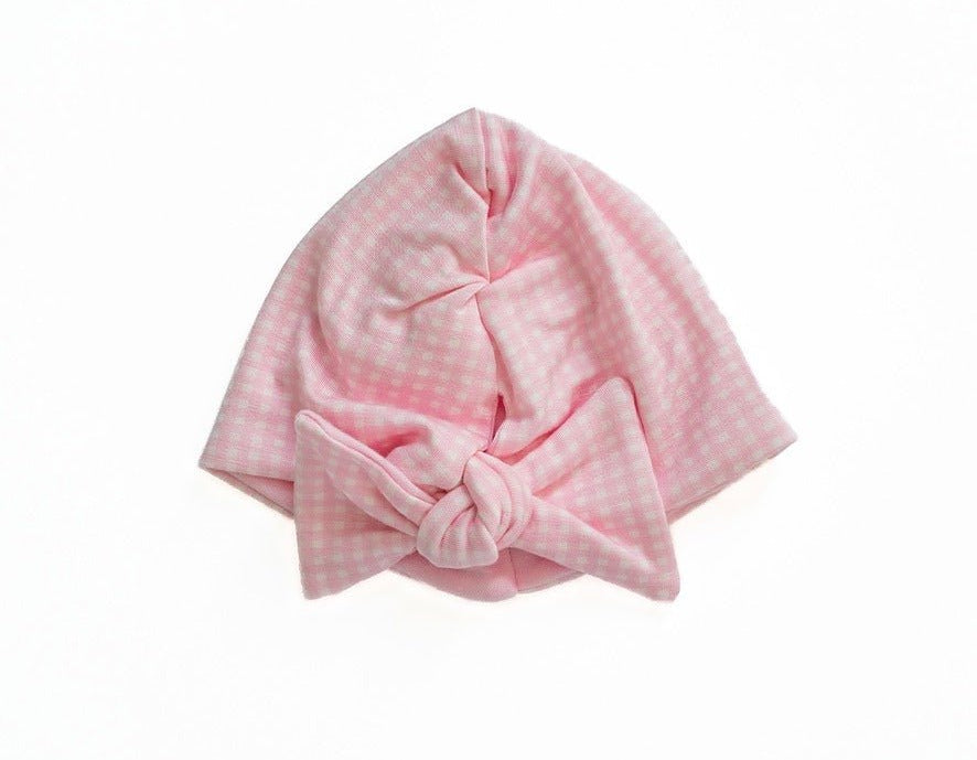 Reversible silky modal ruched beanie with bow in baby pink gingham design.