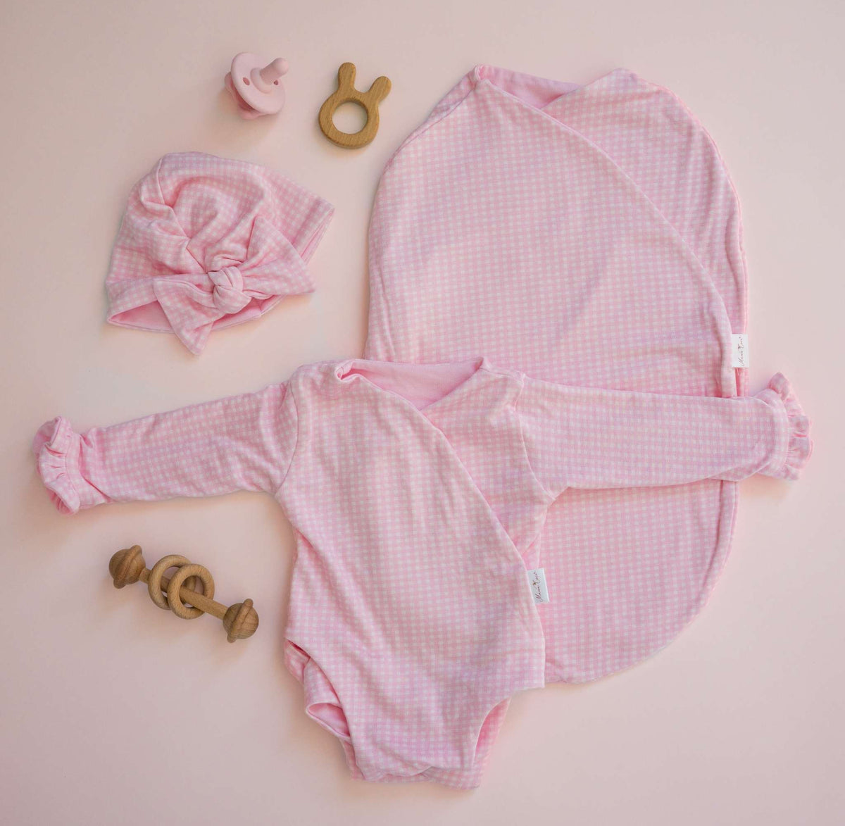 Silky modal long sleeve newborn baby bundle, featuring adorable ruffle cuffs in baby pink gingham design.