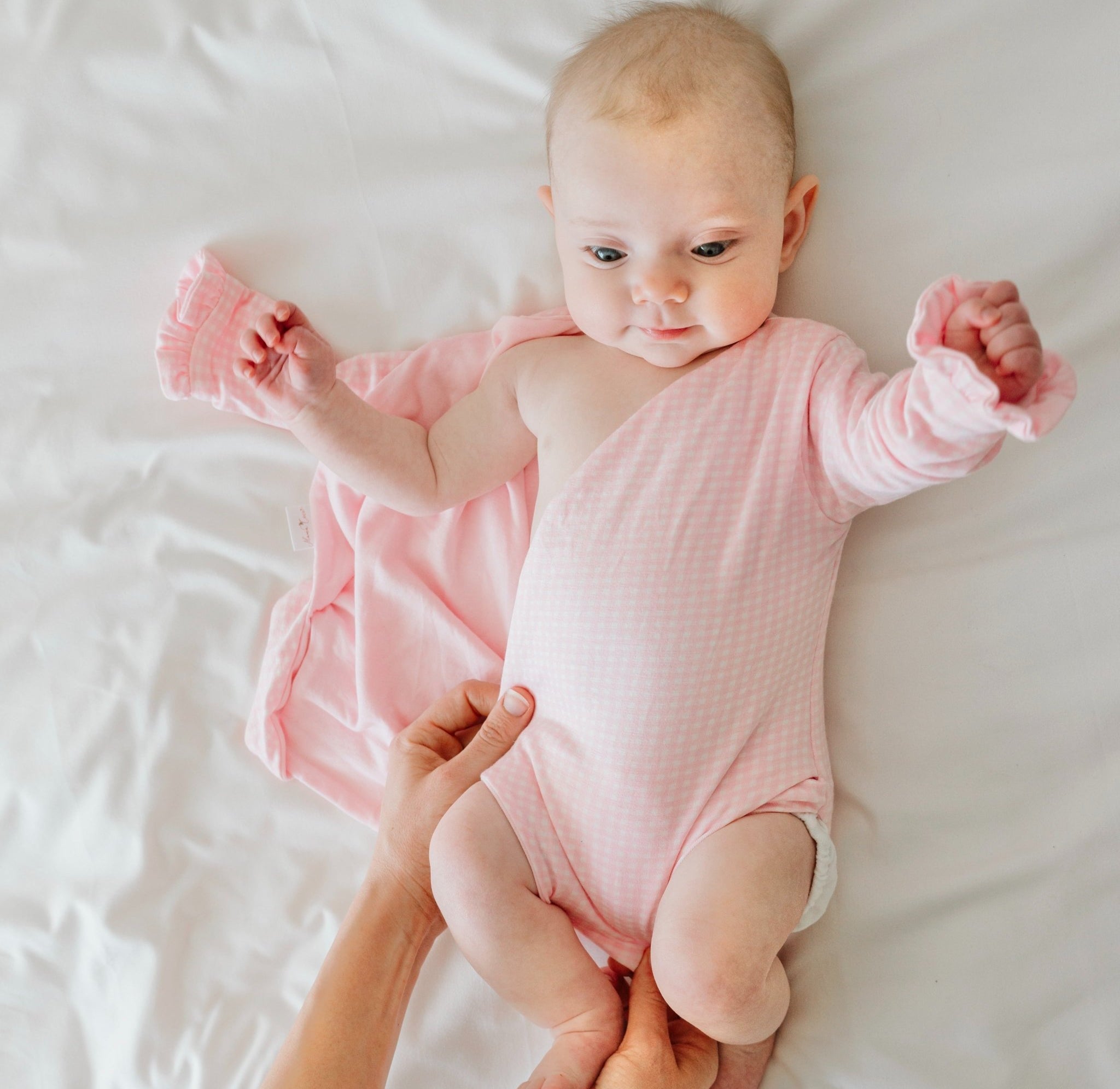 Baby Pink Gingham design ruffle cuff winged bodysuit for babies in silky modal fabric.