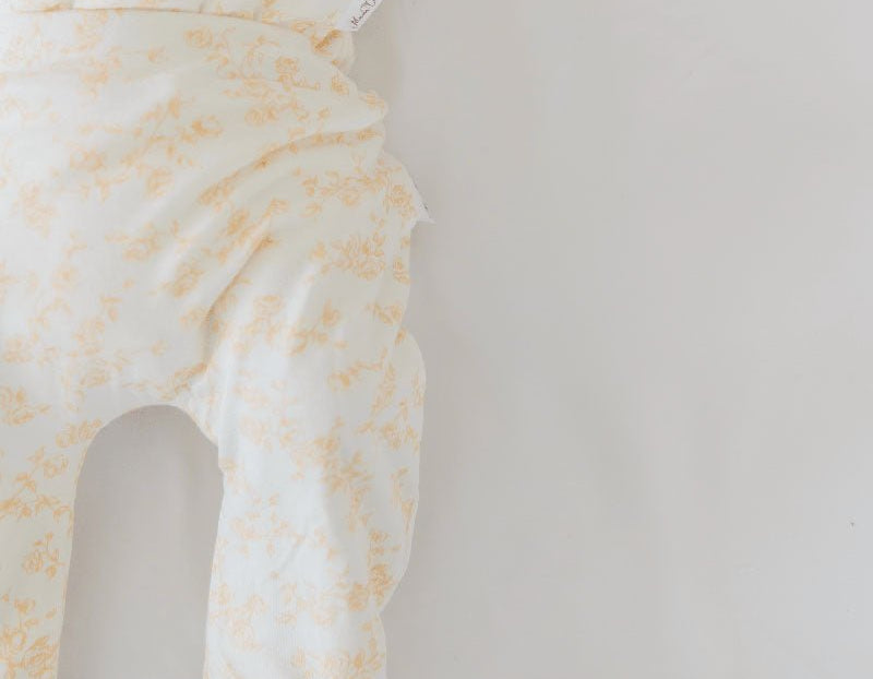 Cozy baby footie pants in silky modal fabric with an adorable Bitty Blooms pattern.