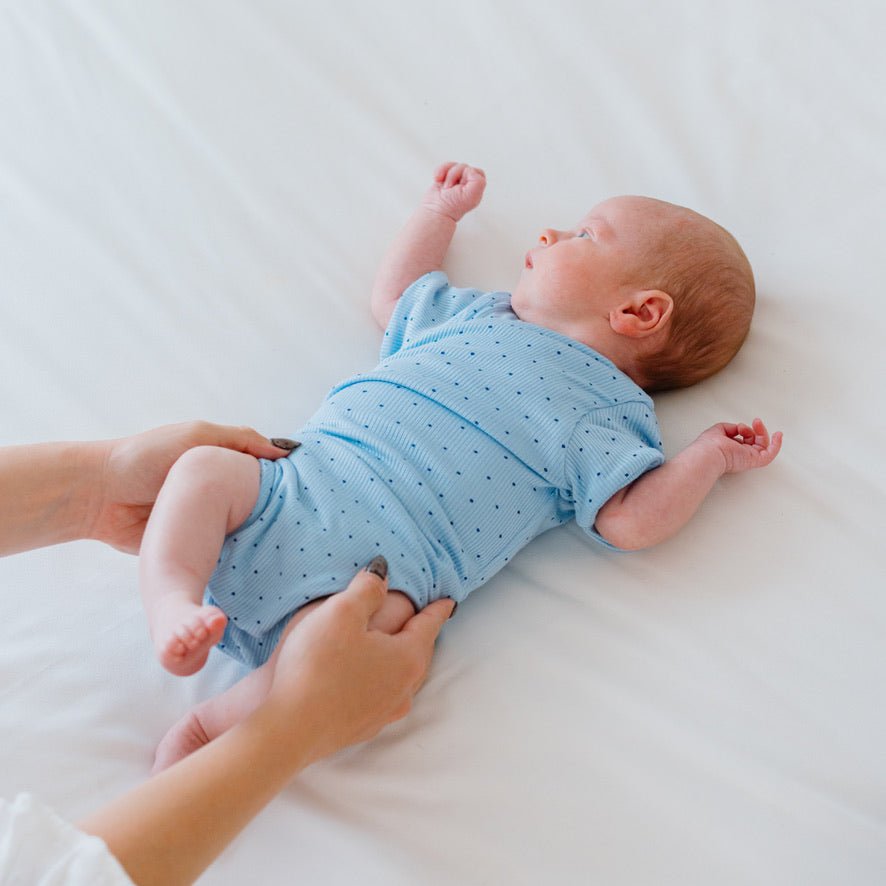 Baby winged bodysuit made from silky modal fabric in Dotted Blues design.