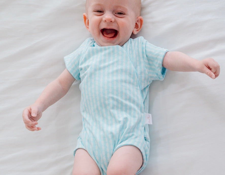 Baby winged bodysuit made from silky modal fabric in Lil Surfer design.