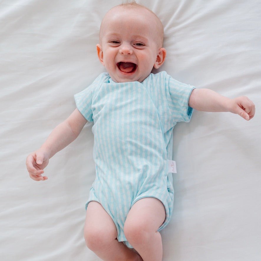 Baby winged bodysuit made from silky modal fabric in Lil Surfer design.