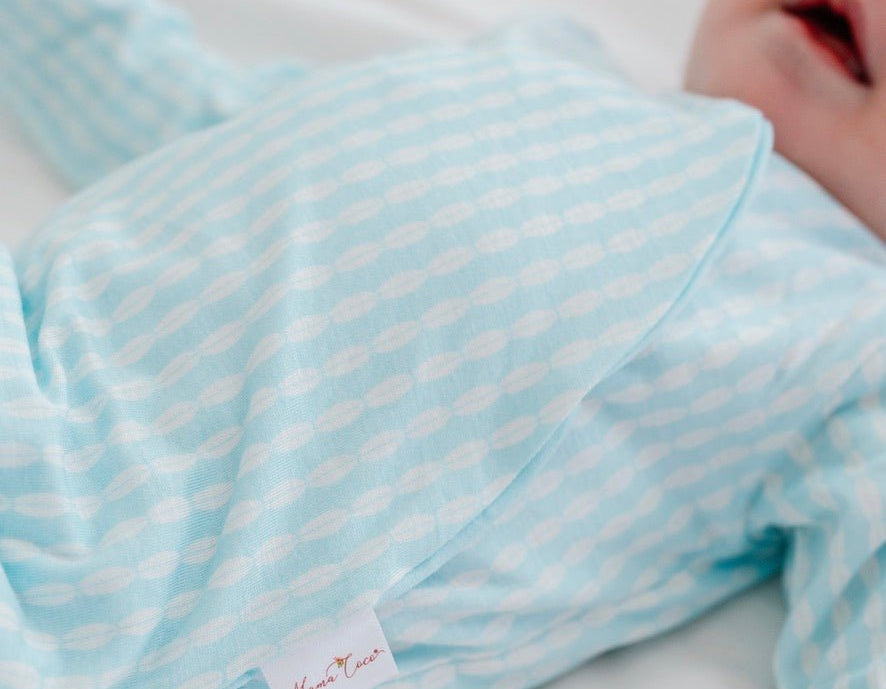 Long sleeved winged bodysuit for babies in silky modal fabric.