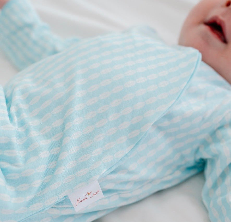 Long-sleeved winged bodysuit for babies in silky modal fabric.