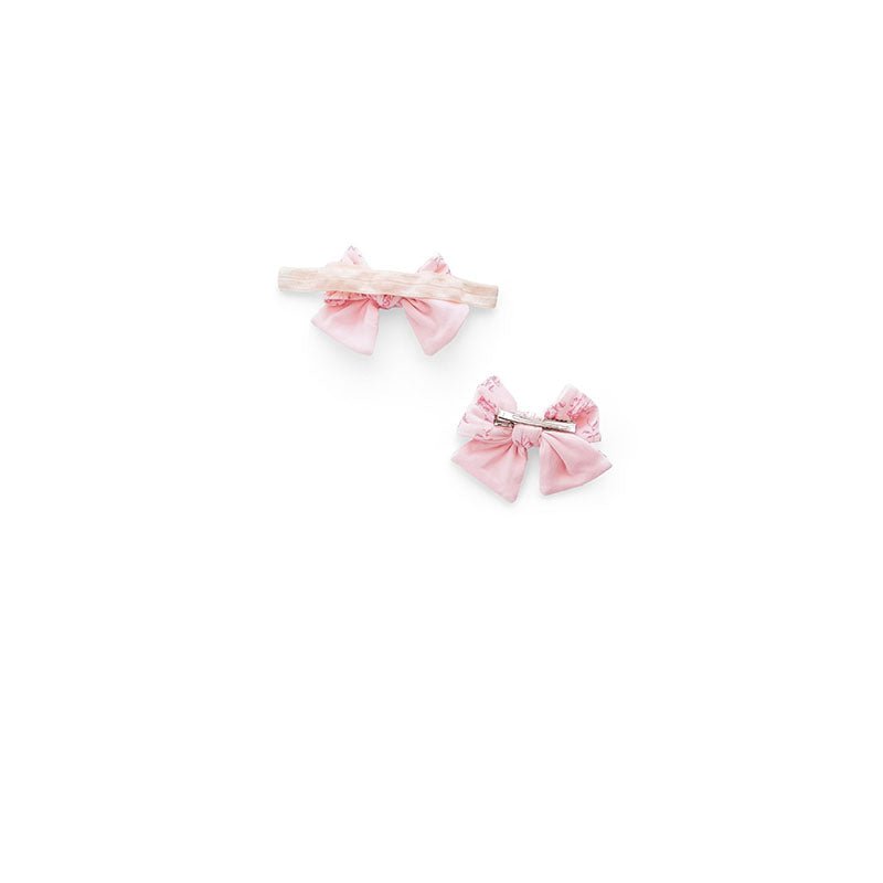 Back view of our bamboo cotton baby headband & bow set in whimsical garden design.