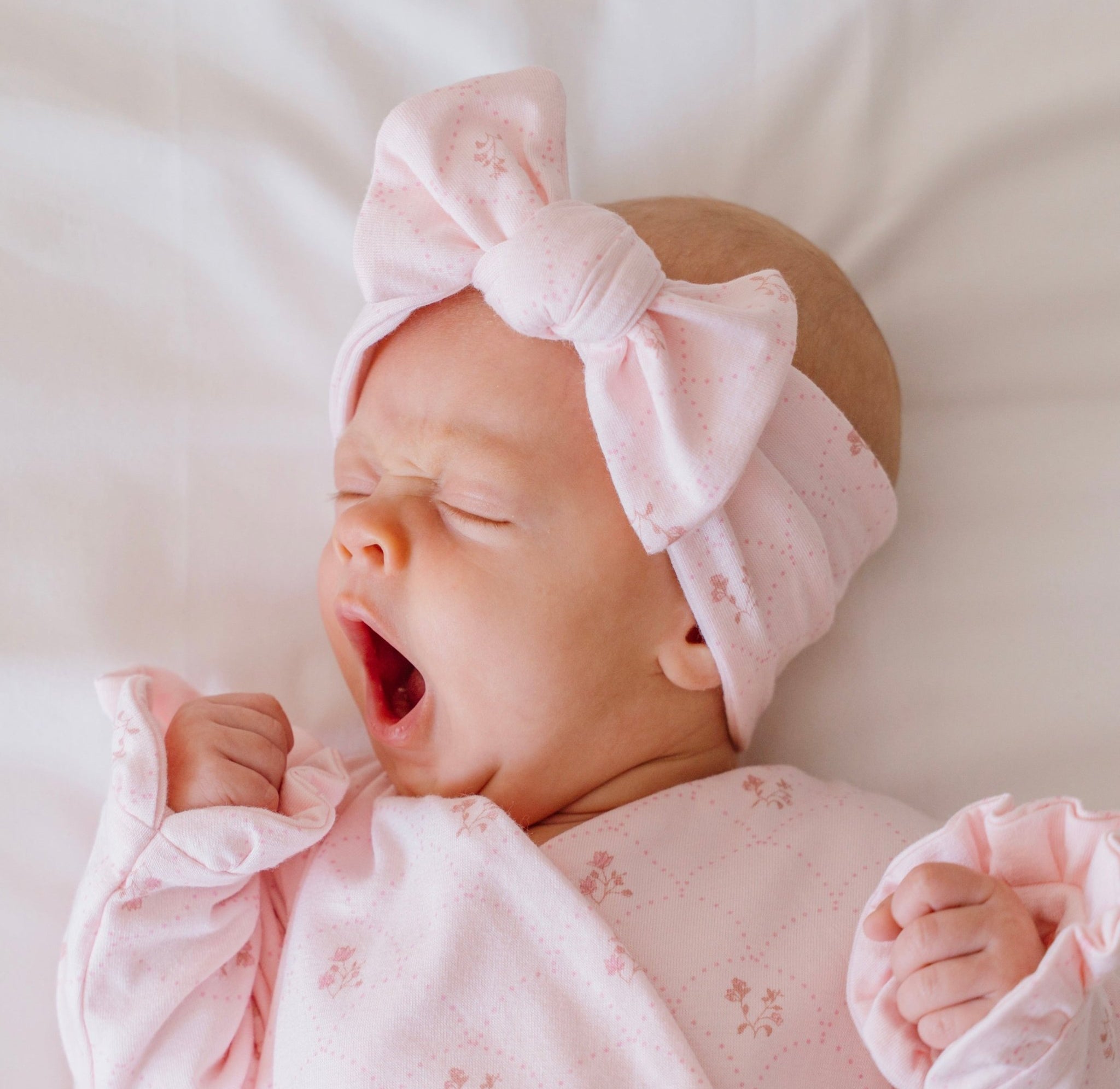 Baby bow headwrap made from bamboo and organic cotton fabric featuring a dainty dots design.