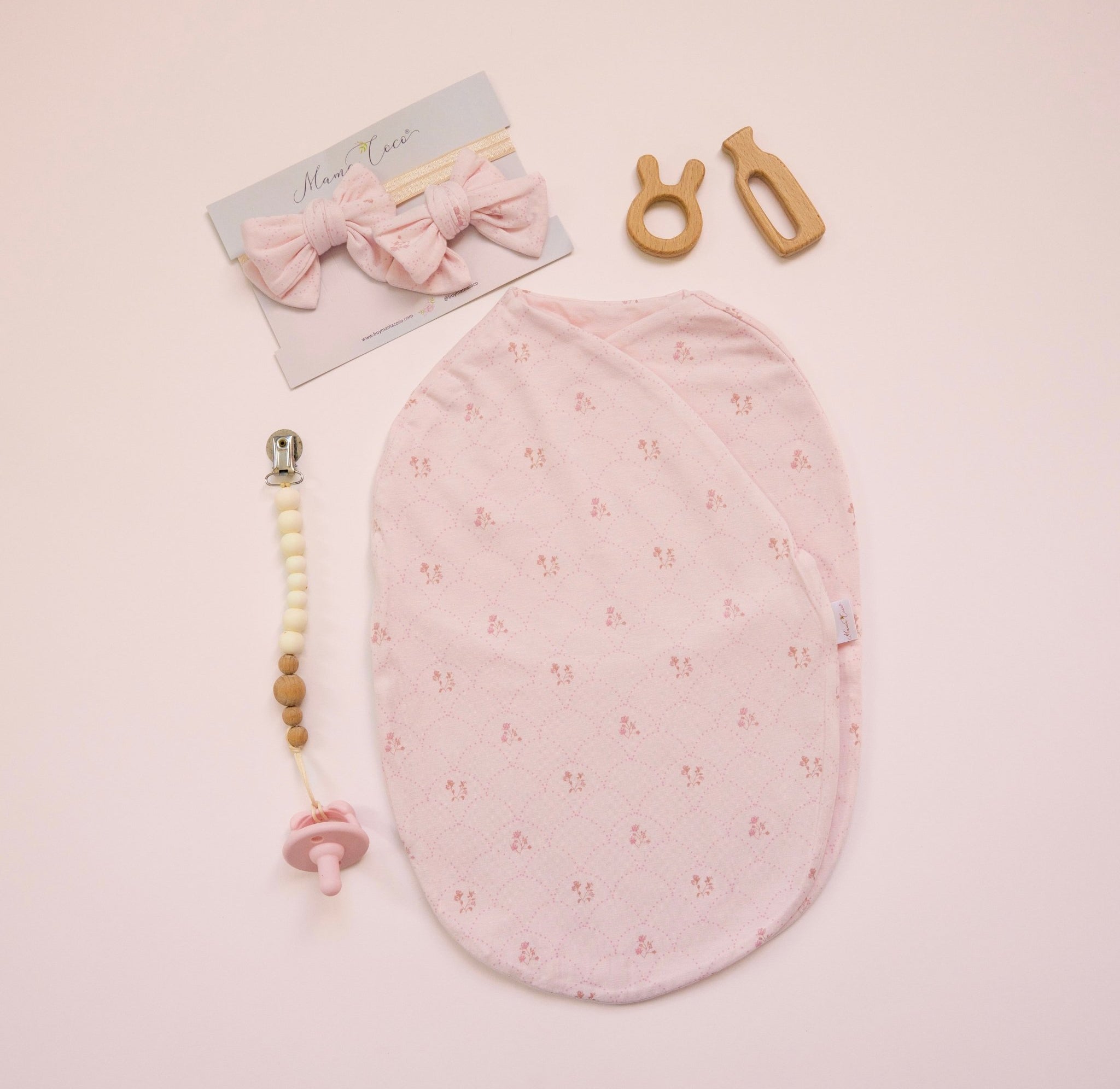 Our bamboo cotton baby headband & bow set in dainty dots design with matching cocoon swaddle.