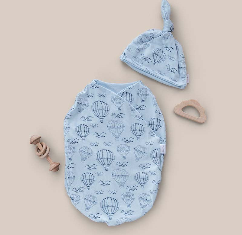 Baby swaddle cocoon blanket crafted from bamboo and organic cotton fabric, decorated with Bon Voyage design.